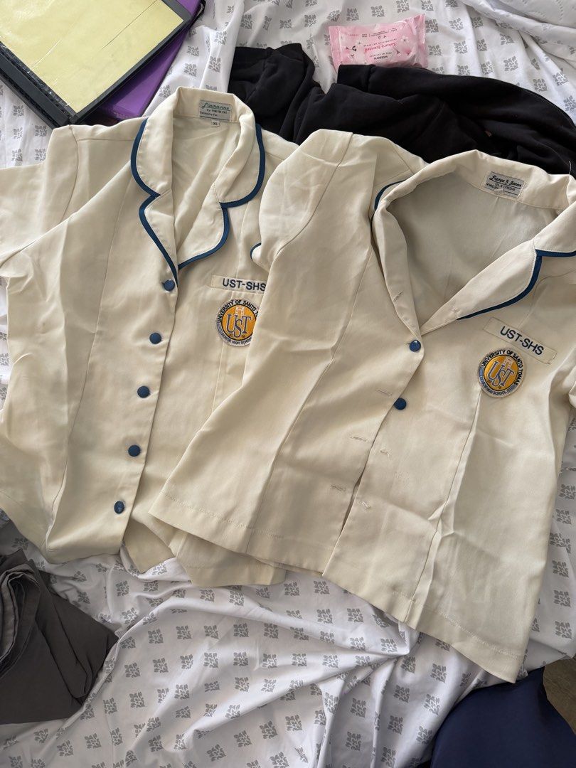 UST SHS Type A Blouse (2 pcs) (Category: Coats, Jackets and Outerwear) located in Manila. Submitted by shekinahiofiel (Listing ID 1461598251, Image 1). Description: - One (1) Large and One (1) XL - XL has minor stain - large is missing 3 buttons payment through Gotyme or Bank Transfer (bdo and bpi).