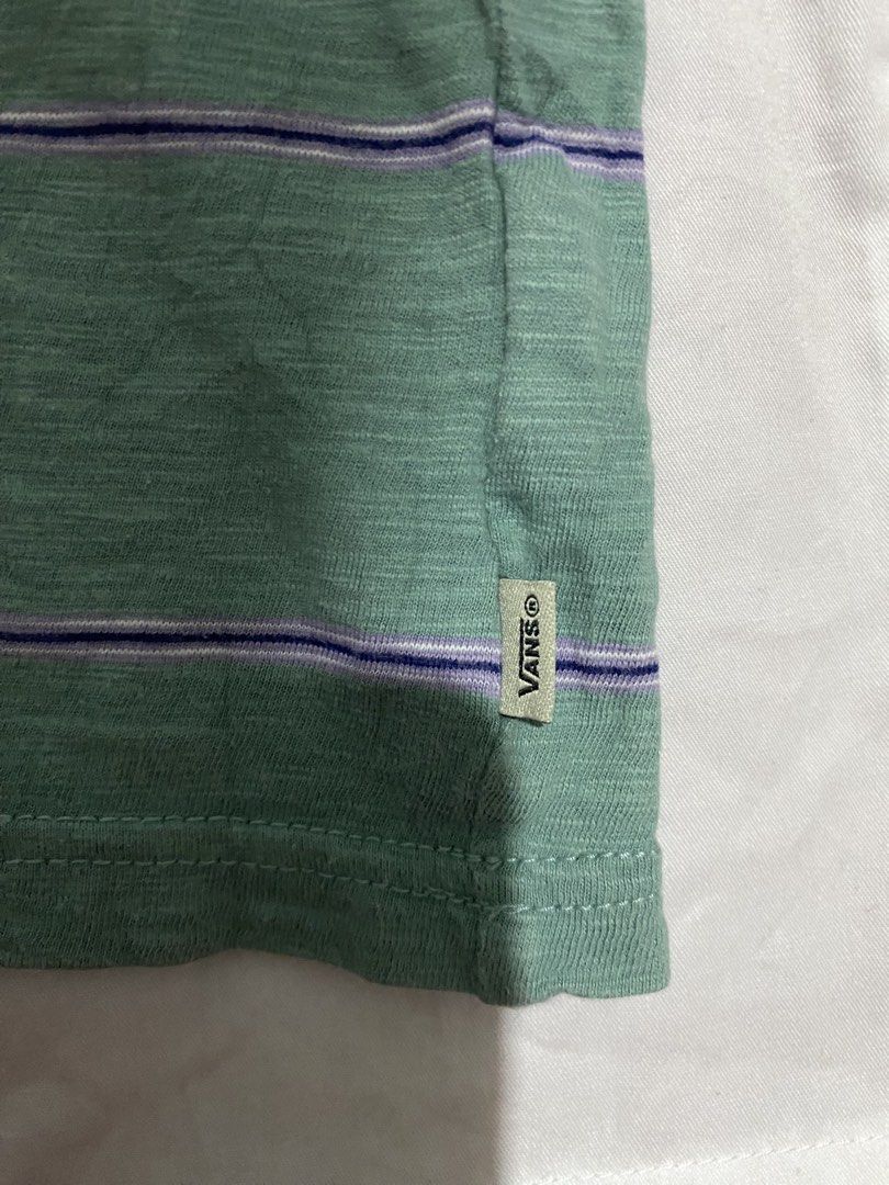 Vans Striped T-Shirt Size L (Category: Tshirts & Polo Shirts ) located in Makati City. Submitted by dymon_08 (Listing ID 1461720249, Image 3). Description: - Green Vans t-shirt - Purple and white stripes - Size L - Small mark on sleeve (circled in last photo).