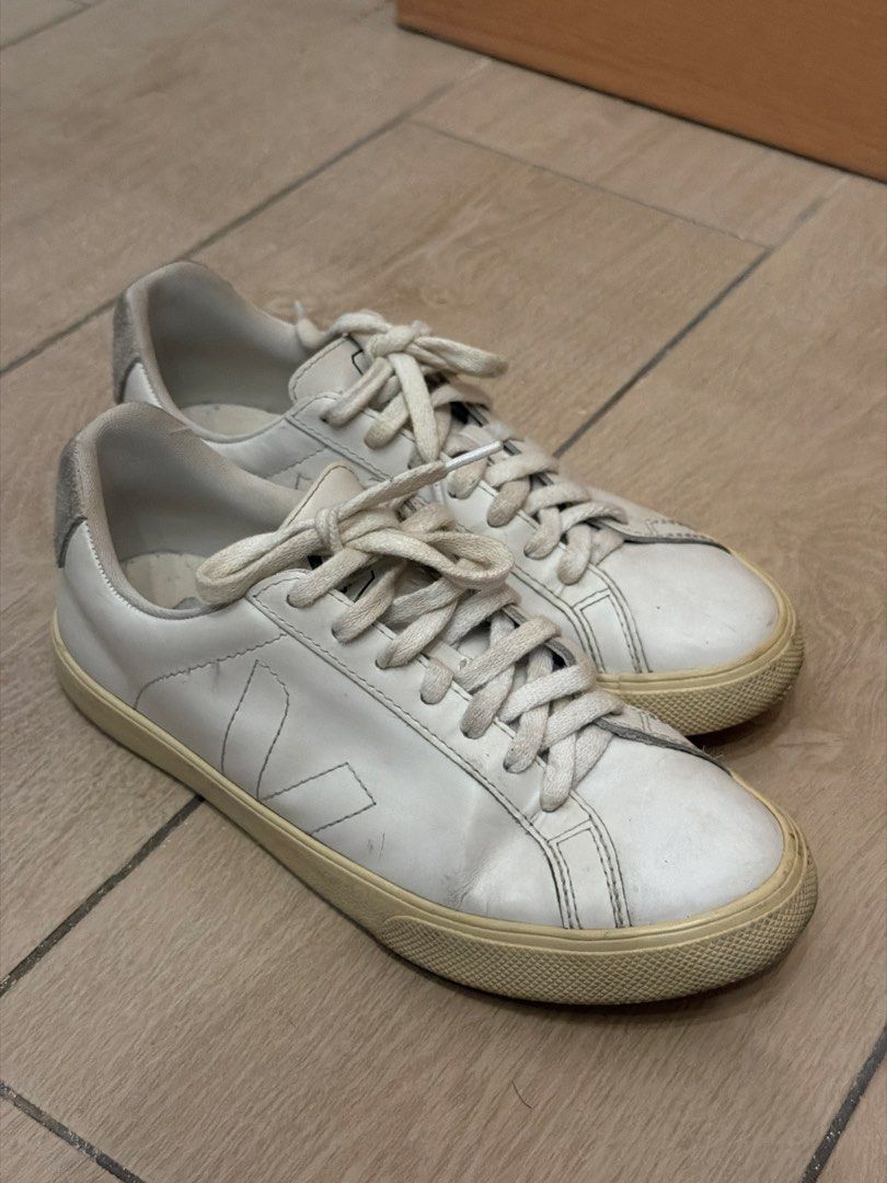 Veja White Leather Sneakers (Category: Sneakers) located in Taguig. Submitted by gabgabie (Listing ID 1461710230, Image 2). Description: - White leather Veja low-top sneakers - Signature V logo on the side - White laces - Light cream colored soles - Minor scuffs on leather and soles from regular wear - Plenty of life remaining - Ideal for everyday use - EU 37 / US 6.