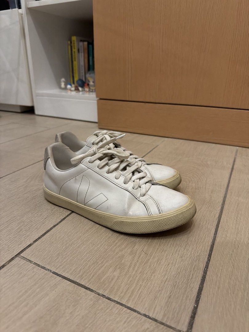 Veja White Leather Sneakers (Category: Sneakers) located in Taguig. Submitted by gabgabie (Listing ID 1461710230, Image 1). Description: - White leather Veja low-top sneakers - Signature V logo on the side - White laces - Light cream colored soles - Minor scuffs on leather and soles from regular wear - Plenty of life remaining - Ideal for everyday use - EU 37 / US 6.