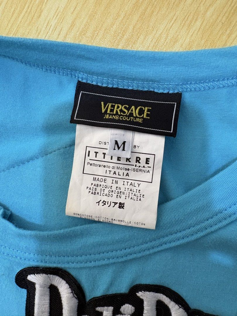 Versace (Category: Sleeveless) located in Echague. Submitted by jake_rc (Listing ID 1461610442, Image 3). Description: Versace embroidered graphic tank top featuring “Delirium” and “Fight” patches with exposed zipper details. Womens Size medium Issue: light yellow stains not so noteceable Price 1,350 plus SF.