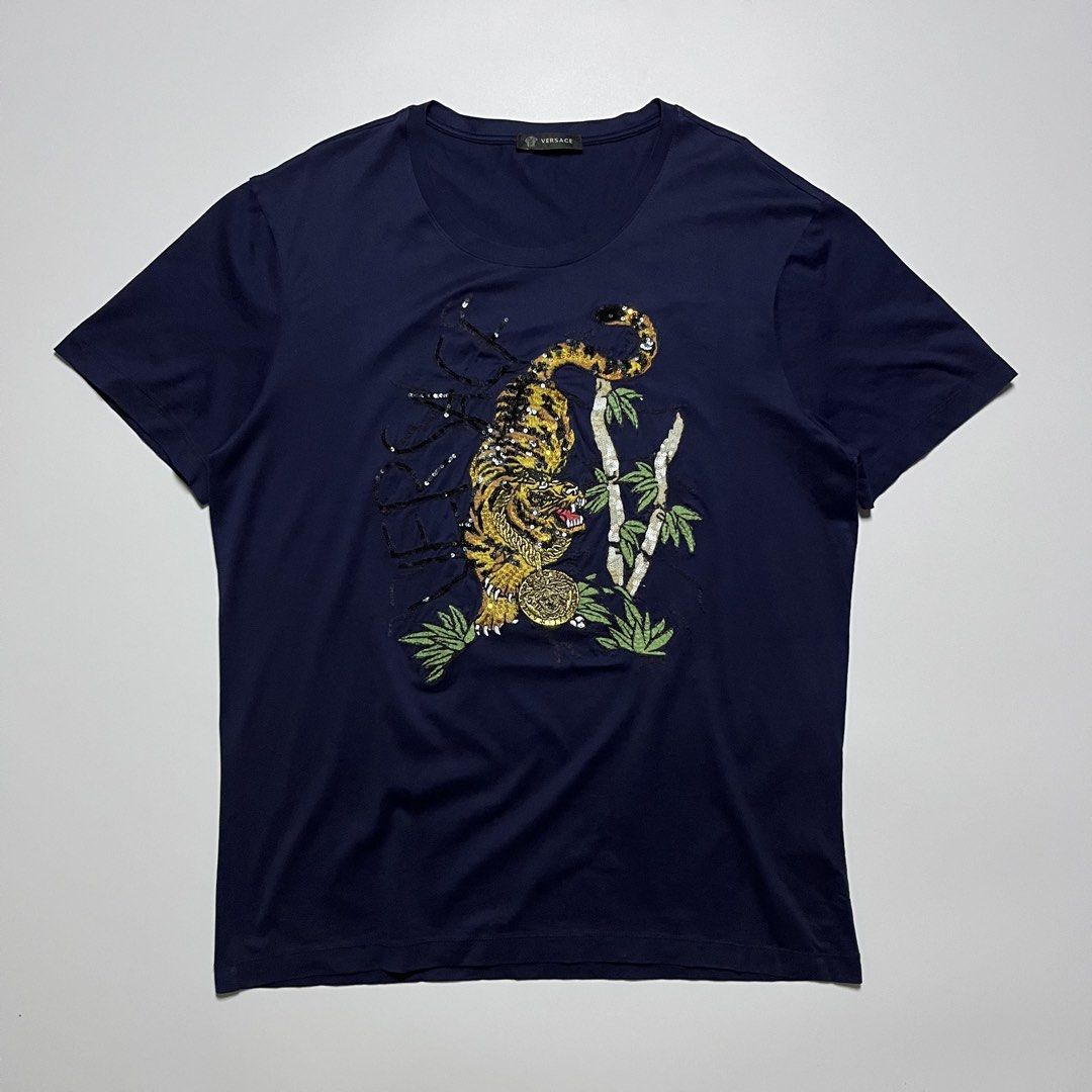 Versace Tiger Embroided T-Shirt (Category: Formal Shirts) located in Cebu City. Submitted by franceuy (Listing ID 1461738929, Image 1). Description: Excellent Condition No Issue W-21 L-27.5 Color rate: 10/10 Cebu City📍.