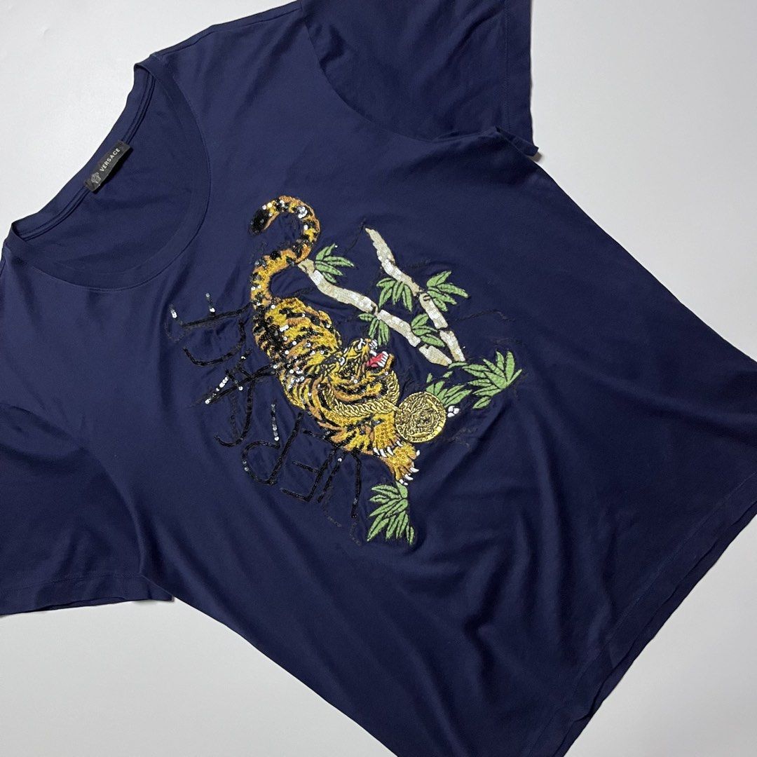 Versace Tiger Embroided T-Shirt (Category: Formal Shirts) located in Cebu City. Submitted by franceuy (Listing ID 1461738929, Image 3). Description: Excellent Condition No Issue W-21 L-27.5 Color rate: 10/10 Cebu City📍.