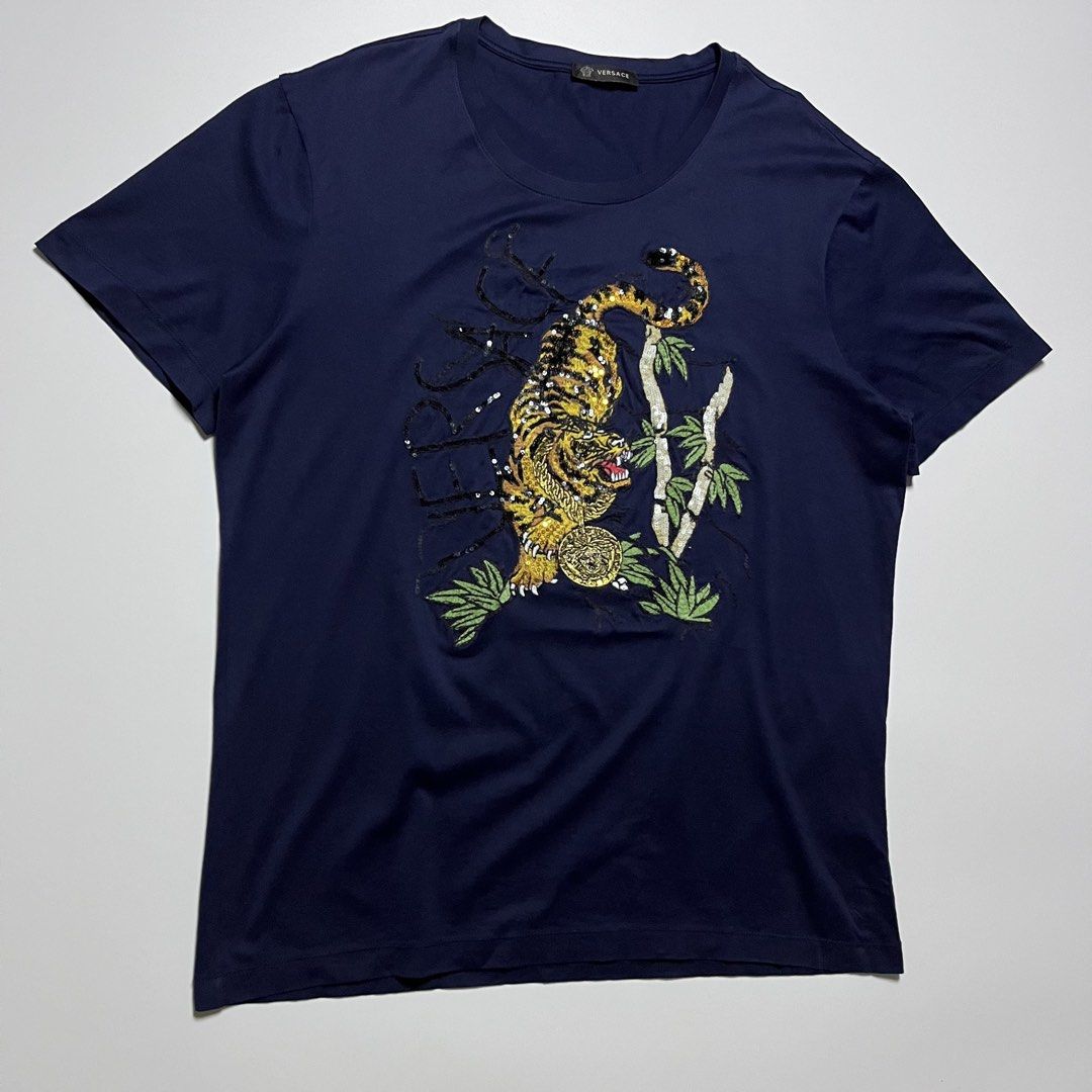 Versace Tiger Embroided T-Shirt (Category: Formal Shirts) located in Cebu City. Submitted by franceuy (Listing ID 1461738929, Image 2). Description: Excellent Condition No Issue W-21 L-27.5 Color rate: 10/10 Cebu City📍.