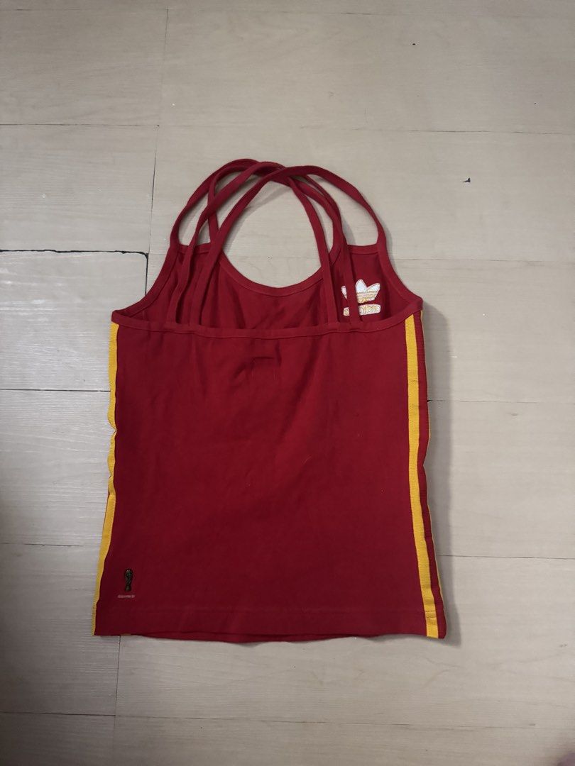Vintage adidas Spain Logo (Category: Activewear) located in Manila. Submitted by juhjuh (Listing ID 1461685933, Image 3). Description: - Red Adidas tank top - Yellow stripes - Features Spain national football team crest - Strappy back design - Perfect for sports or casual wear - Made in Indonesia.