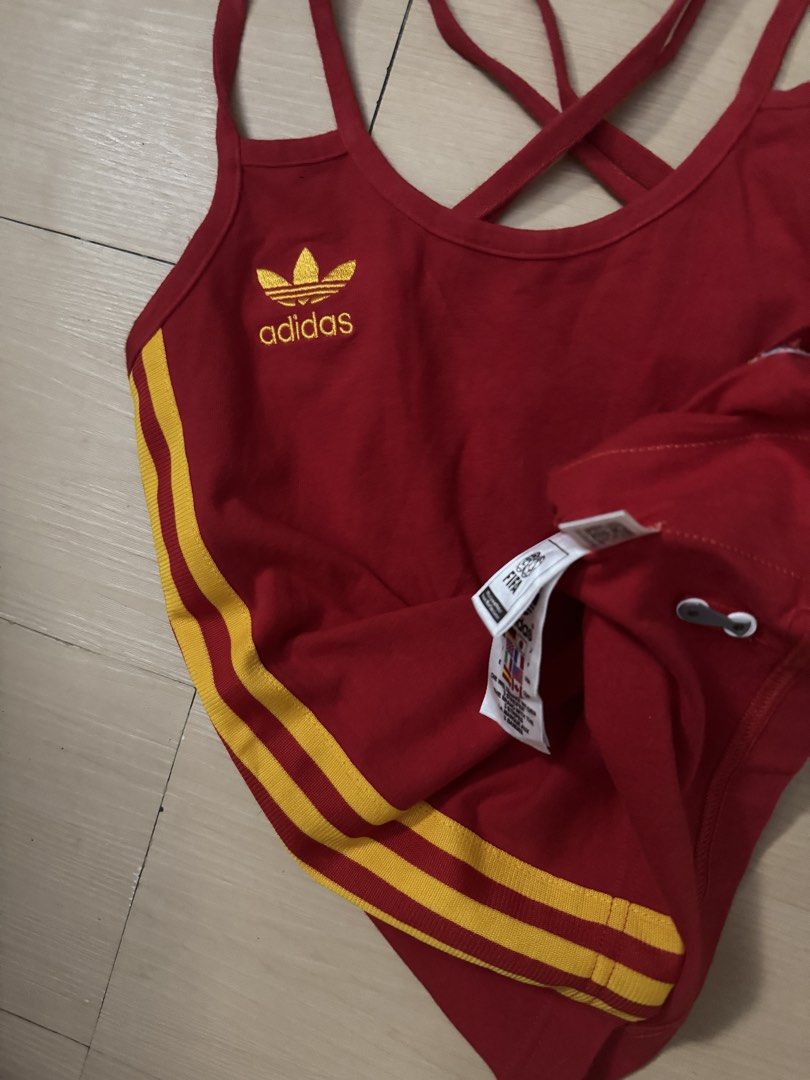 Vintage adidas Spain Logo (Category: Activewear) located in Manila. Submitted by juhjuh (Listing ID 1461685933, Image 2). Description: - Red Adidas tank top - Yellow stripes - Features Spain national football team crest - Strappy back design - Perfect for sports or casual wear - Made in Indonesia.