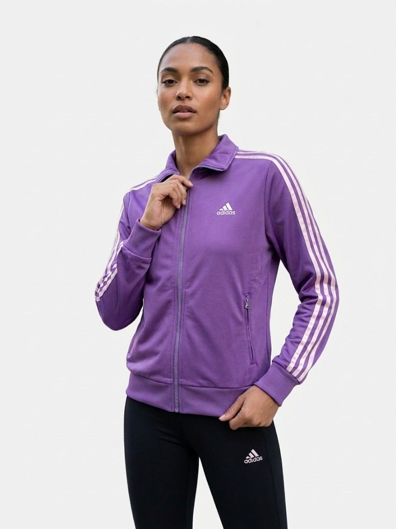 Vintage Adidas Purple Track Jacket (Category: Coats, Jackets and Outerwear) located in San Juan City. Submitted by marie_d_r (Listing ID 1461563727, Image 1). Description: - Purple Adidas track jacket - Classic white stripes on sleeves - Zip-up front with pockets - Size: Womens Large (L) - Ideal for casual wear or sports activities.
