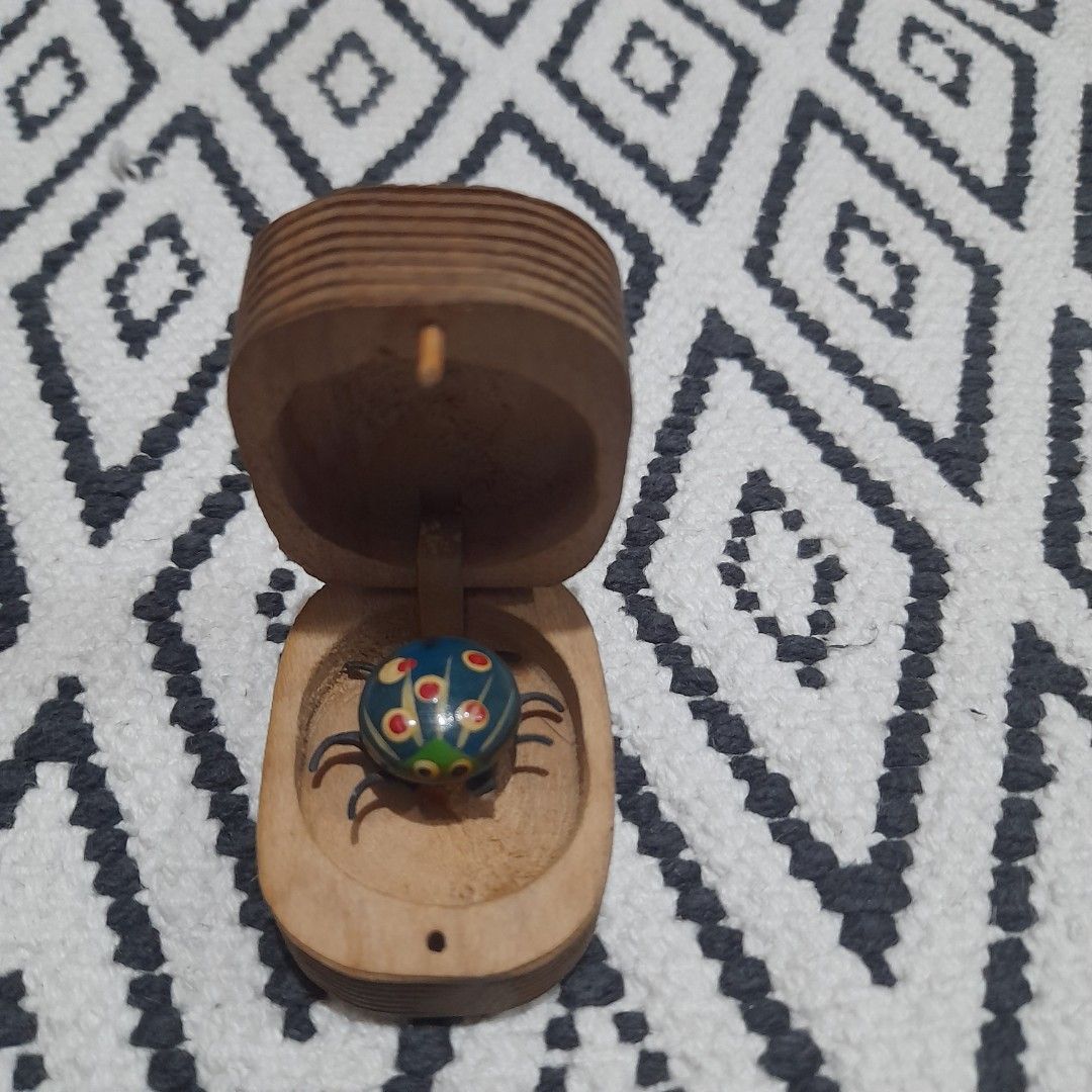 Vintage Beetle in a wooden case (Category: Vintage Collectibles) located in Bocaue. Submitted by marajapansurplus (Listing ID 1461700462, Image 1). Description: - Vintage beetle toy - Comes in a wooden case - Colorful and unique design - Suitable for ages 8 and up - selling as it is - it's legs are moving - Great collectible item.