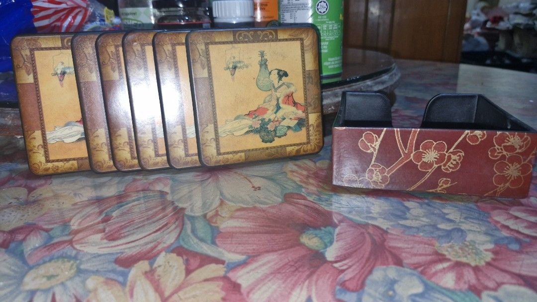 Vintage coasters sets of 6 (Category: Vintage Collectibles) located in Quezon City. Submitted by belikabim2014 (Listing ID 1461788747, Image 2). Description: - pricebisboer set - Set of 6 vintage coasters - Includes a decorative holder - Features intricate oriental and Parisian-themed artwork - Ideal for protecting tables and surfaces from drinks - Adds a touch of vintage charm to any home decor.