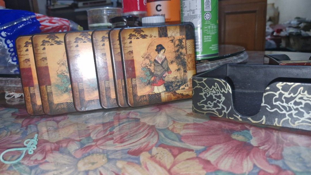 Vintage coasters sets of 6 (Category: Vintage Collectibles) located in Quezon City. Submitted by belikabim2014 (Listing ID 1461788747, Image 1). Description: - pricebisboer set - Set of 6 vintage coasters - Includes a decorative holder - Features intricate oriental and Parisian-themed artwork - Ideal for protecting tables and surfaces from drinks - Adds a touch of vintage charm to any home decor.