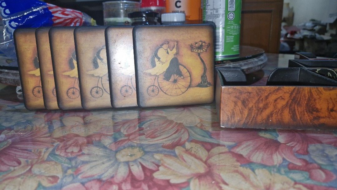Vintage coasters sets of 6 (Category: Vintage Collectibles) located in Quezon City. Submitted by belikabim2014 (Listing ID 1461788747, Image 3). Description: - pricebisboer set - Set of 6 vintage coasters - Includes a decorative holder - Features intricate oriental and Parisian-themed artwork - Ideal for protecting tables and surfaces from drinks - Adds a touch of vintage charm to any home decor.