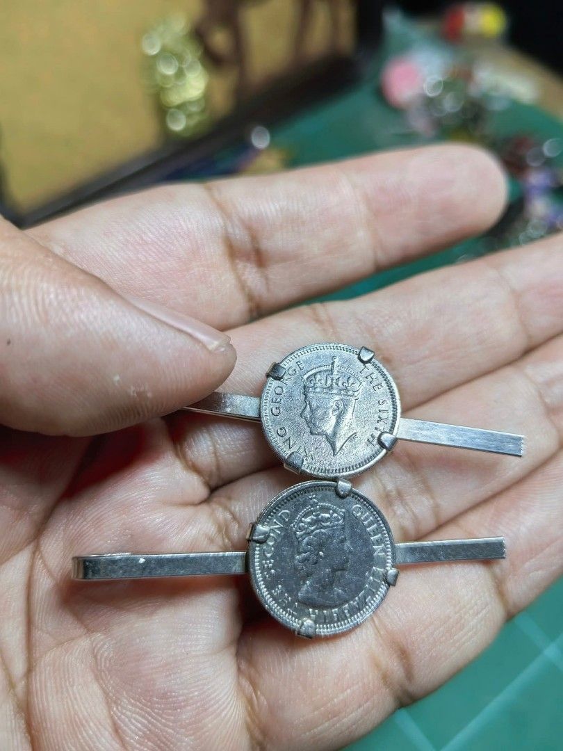 Vintage Coin Tie Clips (Category: Ties) located in Cebu City. Submitted by dudes_villanueva (Listing ID 1461574069, Image 3). Description: Tie Clip - Vintage Coin Tie Clips or Collar Bars Featuring British Monarchs - Pair 📌 Top Clip: Features a coin with the profile of King George VI ("GEORGIVS VI"). 📌 Bottom Clip: Features a coin with the profile of Queen Elizabeth II ("QUEEN ELIZABETH THE SECOND"). 📌 Style: Metal bar-style tie clips or colla