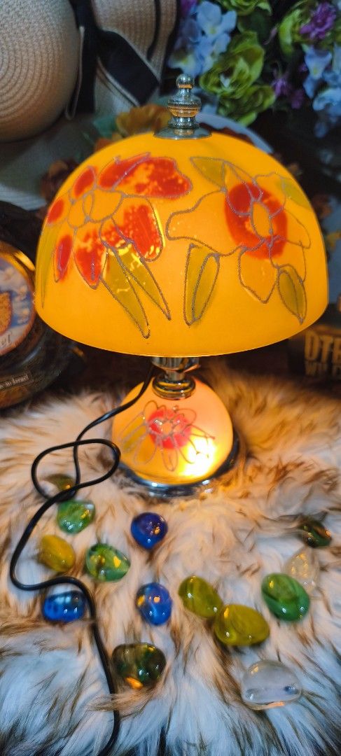 VINTAGE TIFFANY STYLE LAMPSHADE (Category: Vases & Decorative Bowls) located in Manila. Submitted by shawn0320_fish (Listing ID 1461563369, Image 2). Description: This image displays a vintage-style glass table lamp decorated with a reverse-painted or frosted-etched colorful floral design. The lamp features a distinctive dome or mushroom-shaped top shade paired with a matching rounded, illuminated glass pedestal base. This specific design mimics 