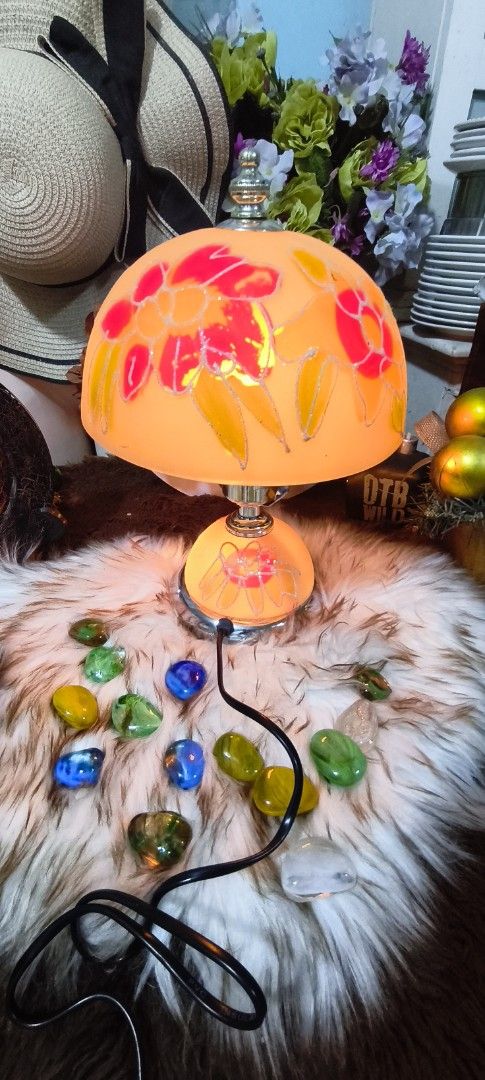 VINTAGE TIFFANY STYLE LAMPSHADE (Category: Vases & Decorative Bowls) located in Manila. Submitted by shawn0320_fish (Listing ID 1461563369, Image 1). Description: This image displays a vintage-style glass table lamp decorated with a reverse-painted or frosted-etched colorful floral design. The lamp features a distinctive dome or mushroom-shaped top shade paired with a matching rounded, illuminated glass pedestal base. This specific design mimics 