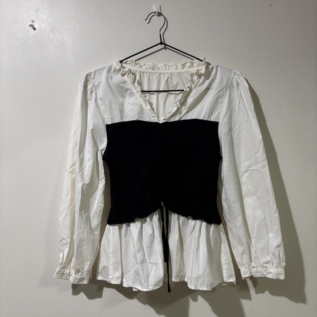 Vintage White Bustier Peplum Blouse (Category: Longsleeves) located in Binan City. Submitted by mypreloved_haul (Listing ID 1461714299, Image 1). Description: Fits xs to small This is a black-and-white layered 2-in-1 long-sleeve blouse featuring a fitted black corset-style bustier overlay with a center drawstring..