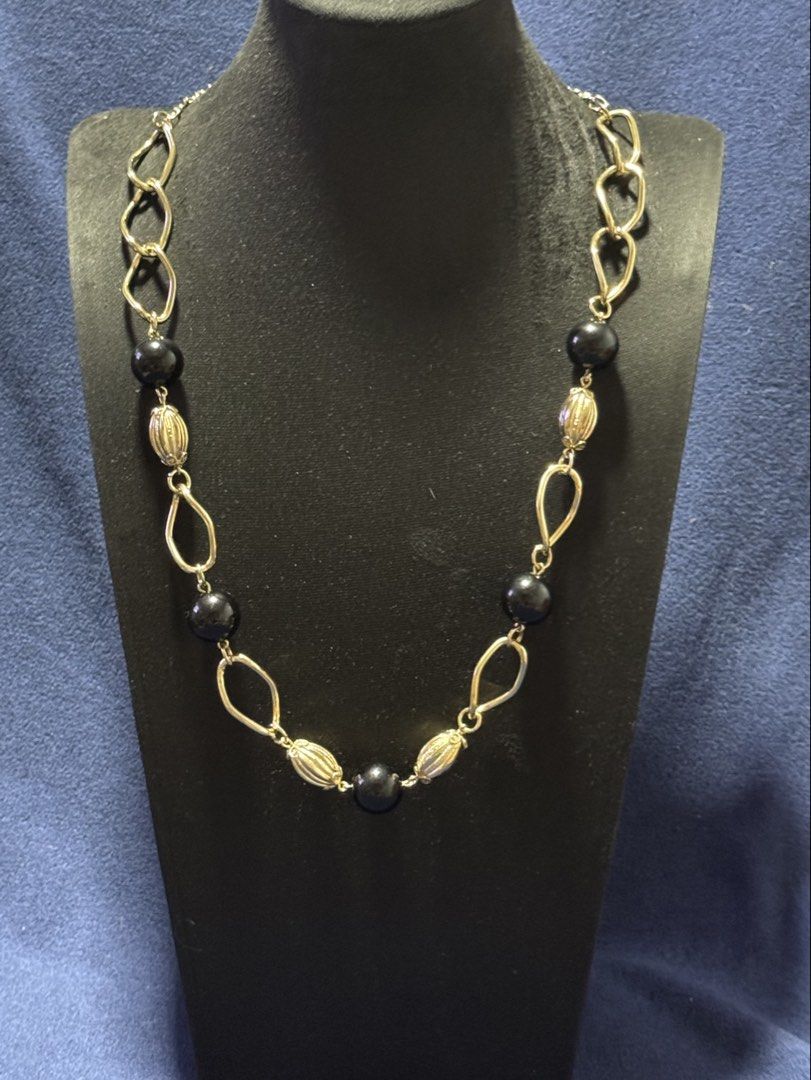 vintage-style gold-tone chain accessory (Category: Necklaces) located in Angeles City. Submitted by zyeplustradings (Listing ID 1461635754, Image 2). Description: vintage-style gold-tone chain accessory configured with open-link geometric sections alternating with smooth black spherical beads and textured, ribbed gold melon beads..