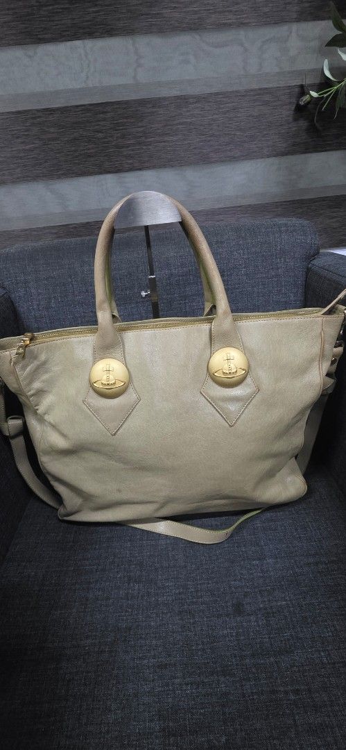 Vivienne Westwood Leather Tote Bag (Category: Luxury Bags & Wallets) located in General Trias. Submitted by roselle2230 (Listing ID 1461687652, Image 1). Description: - Brand: Vivienne Westwood - Color: Light Beige - Material: Leather - Features: Iconic orb logo, gold-tone hardware, zip closure, comfortable top handles, detachable strap, bottom studs for protection - Interior: Spacious, ideal for daily use.