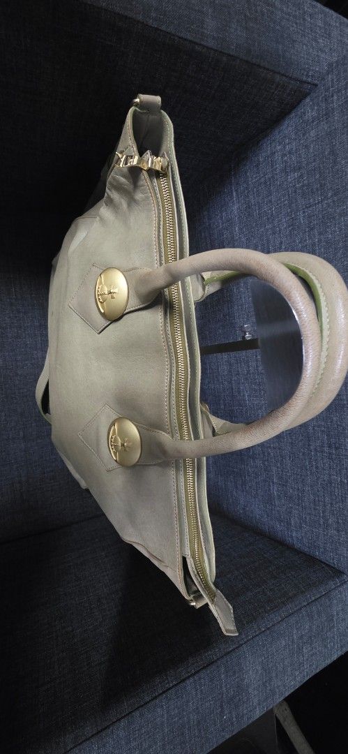 Vivienne Westwood Leather Tote Bag (Category: Luxury Bags & Wallets) located in General Trias. Submitted by roselle2230 (Listing ID 1461687652, Image 3). Description: - Brand: Vivienne Westwood - Color: Light Beige - Material: Leather - Features: Iconic orb logo, gold-tone hardware, zip closure, comfortable top handles, detachable strap, bottom studs for protection - Interior: Spacious, ideal for daily use.