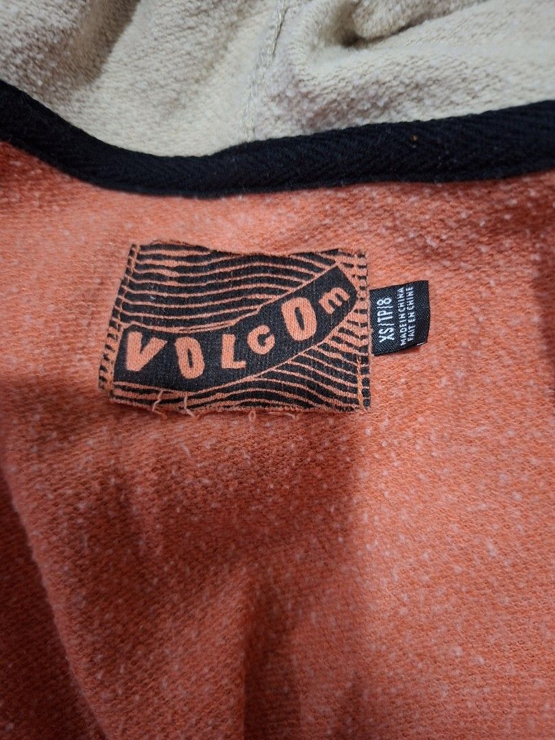 Volcom Orange Striped Hoodie (Category: Coats, Jackets and Outerwear) located in Lapu Lapu. Submitted by margaux099 (Listing ID 1461751101, Image 3). Description: - Orange Volcom zip-up hoodie - Size XS - Black and blue stripes on sleeves and hood - Skull and crossbones graphic on left sleeve - Unique tiger face design on the hood - Front pockets.