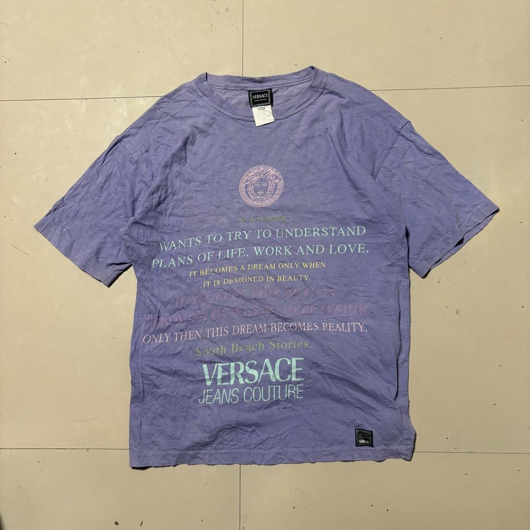 Vtg Versace Jeans Couture Tee (Category: Tshirts & Polo Shirts ) located in Zamboanga. Submitted by thriftyyali (Listing ID 1461693963, Image 1). Description: - Authentic purple Versace Jeans Couture graphic tee - Features iconic Medusa head logo and text print - Size: XS on tag (Medium to Large fitting) - Material: 100% Cotton - Perfect for casual wear - A unique addition to your wardrobe!.