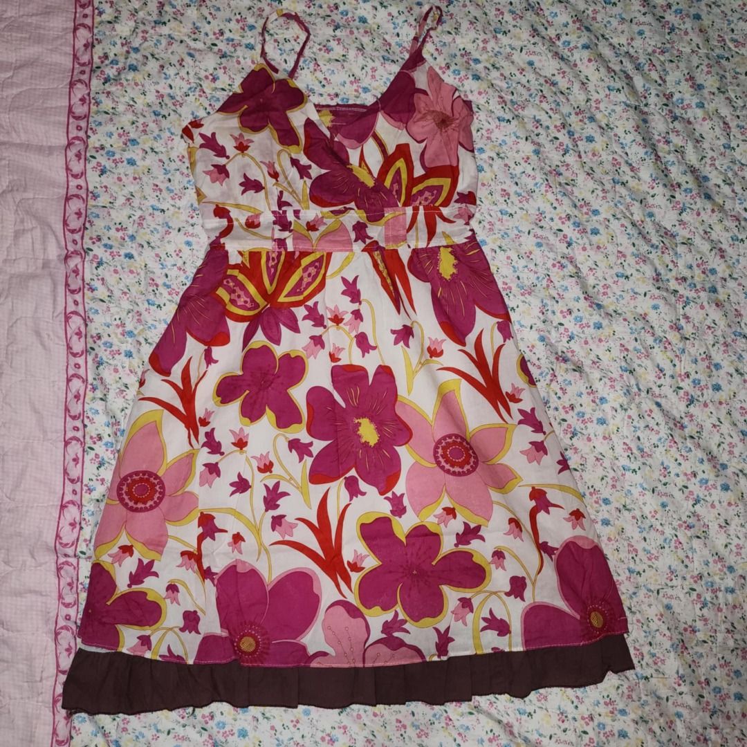 White floral print spaghetti strap dress (Category: Dresses) located in Caloocan City. Submitted by laligayaaaa (Listing ID 1461562718, Image 2). Description: Flowy white summer dress with a colorful floral print (pink, red, yellow flowers). Features spaghetti straps, V-neck, and cinched waist. Perfect for sunny days!.