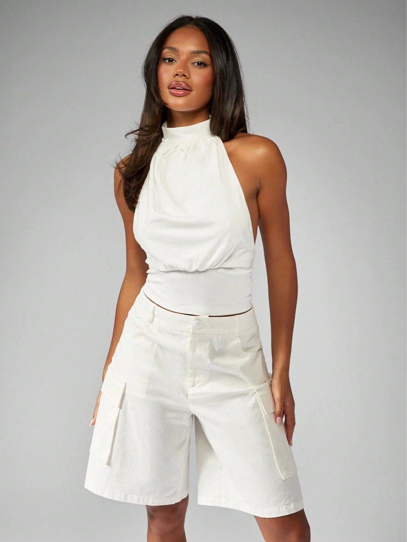 white halter backless top (Category: Sleeveless) located in Quezon City. Submitted by s.haaa (Listing ID 1461697746, Image 1). Description: brand new with tags.