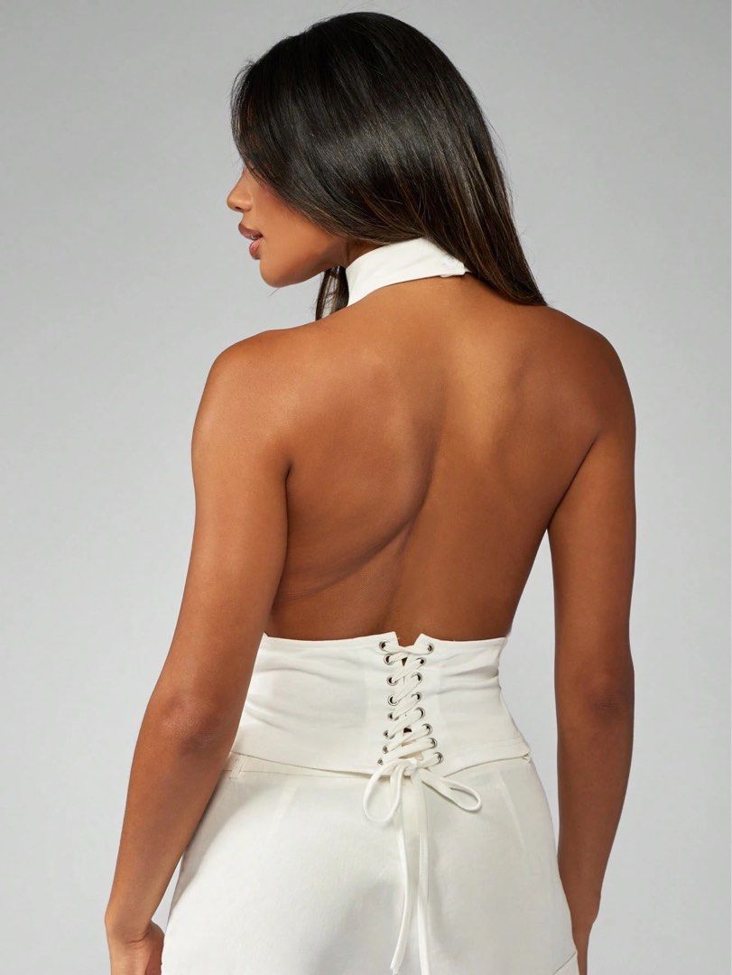 white halter backless top (Category: Sleeveless) located in Quezon City. Submitted by s.haaa (Listing ID 1461697746, Image 2). Description: brand new with tags.