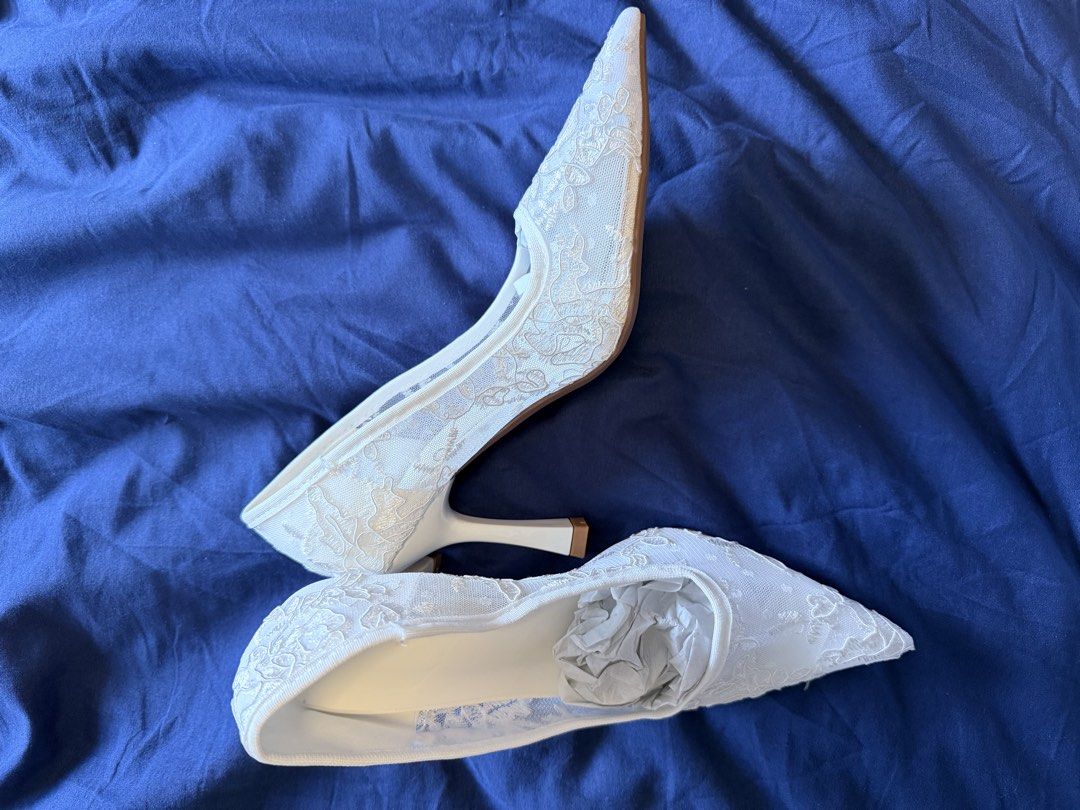 White Lace Pointed Toe Heels Size 37 (Category: Heels) located in Las Pinas. Submitted by pure.sunyy (Listing ID 1461625268, Image 2). Description: - White lace heels with pointed toe - Mesh overlay with delicate floral embroidery - Classic stiletto heel for an elegant look - Ideal for weddings, parties, and special occasions - Size: 37 NEVER WORN RFS: too big for me, i bought one size bigger but when i tried it on. Its too big for me. 📍Taguig C
