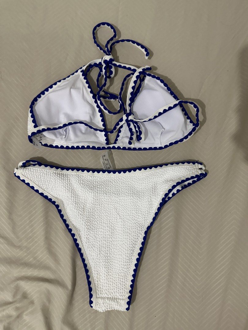 White Textured Bikini with Blue Trim (Category: Bikinis & Swimsuits) located in Lipa City. Submitted by chiechums (Listing ID 1461566349, Image 2). Description: - Cute white textured bikini set - Features a blue scalloped trim - Halter neck top with adjustable ties - High-cut bottoms - Ideal for beach or pool days - Comfortable and stylish.