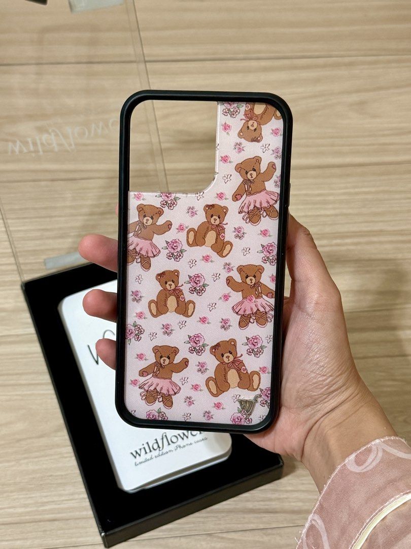 Wildflower iPhone 14 Pro Max Case (Category: Cases & Sleeves) located in Manila. Submitted by carad__ (Listing ID 1461725148, Image 2). Description: - Brand: Wildflower - Model: iPhone 14 Pro Max - Design: Limited edition teddy bears in ballet tutus with pink roses - Condition: Excellent - Style: Cute, whimsical, feminine.