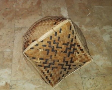 Woven Bamboo Basket with Handles (Category: Storage Boxes & Baskets) located in Pasig City. Submitted by kuhkuh (Listing ID 1461590562, Image 3). Description: Handwoven bamboo basket - Natural wood color with black woven accents - Two sturdy handles for easy carrying - Ideal for storage or decorative purposes - Features a unique geometric pattern on the sides.