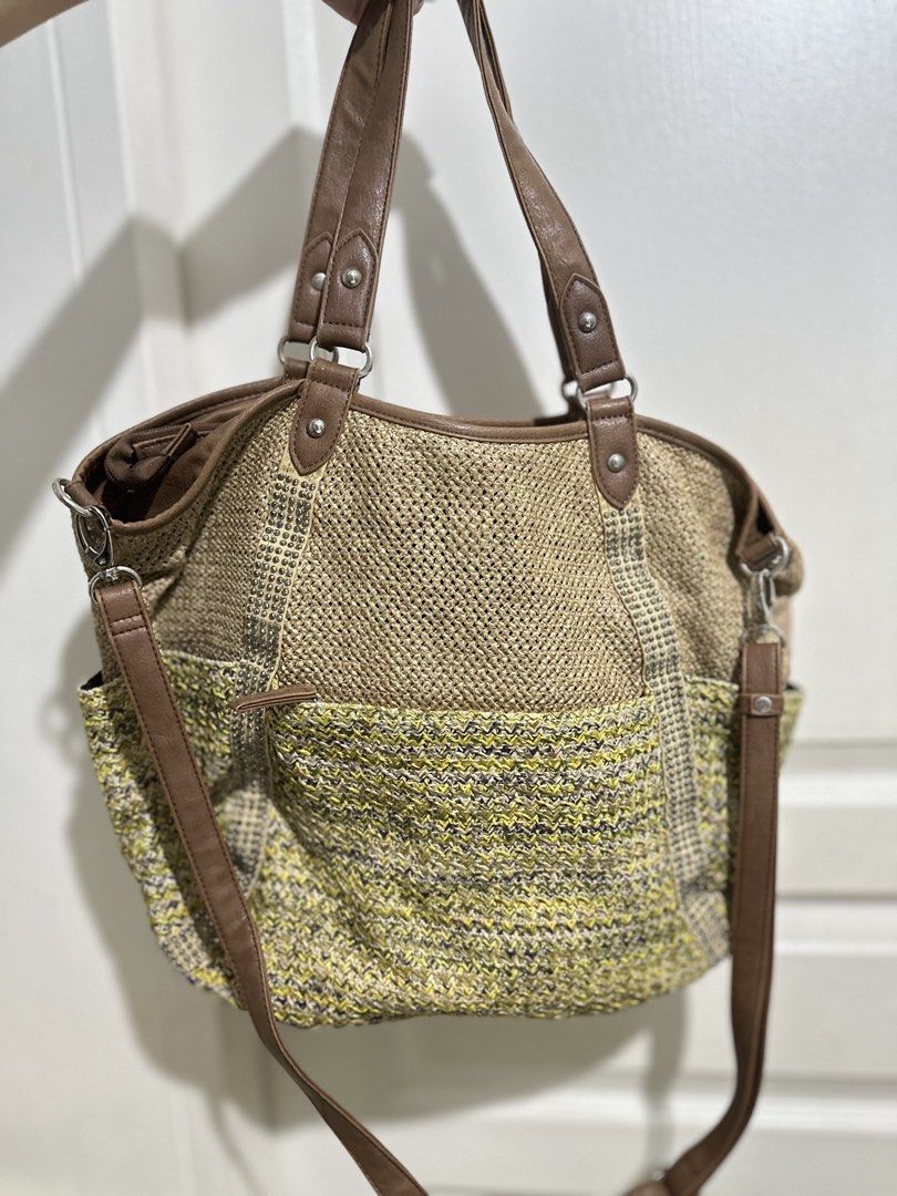 Woven Tote Bag with Leather Straps (Category: Tote Bags) located in Mandaluyong City. Submitted by TheWeekendProject (Listing ID 1461516927, Image 2). Description: - Cute woven tote bag - Brown leather straps - Textured pattern with yellow and brown accents - Zipper closure at the top - Detachable shoulder strap included - Spacious interior for essentials - Ideal for everyday use or beach trips - Dimension: 18” x 13 “ x 4”.