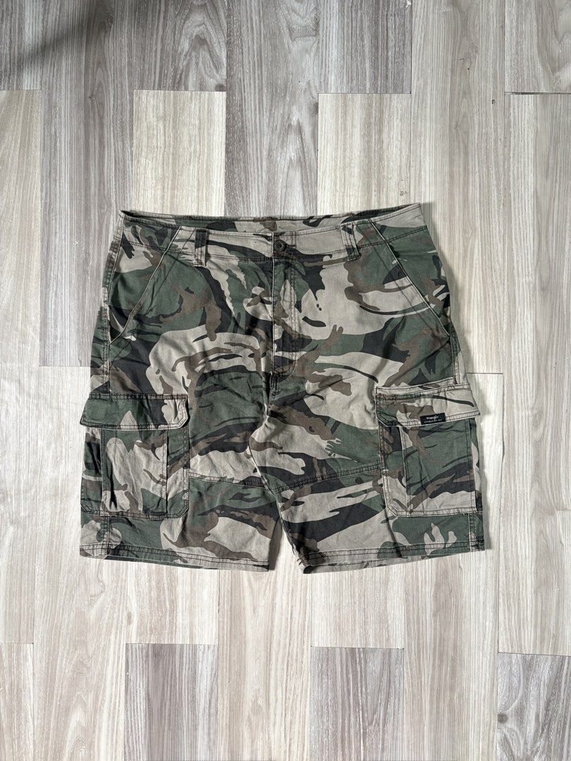 Wrangler Camo Cargo Shorts Size 38 (Category: Shorts) located in Rizal. Submitted by thriftdrip.402 (Listing ID 1461703582, Image 1). Description: - Brand: Wrangler - Type: Camo Cargo Shorts - Size: 38 Waist - Design: Classic camouflage pattern - Features: Multiple pockets for ample storage - Closure: Button and zip fly - Ideal for: Casual wear, outdoor activities - Origin: Made in Bangladesh.