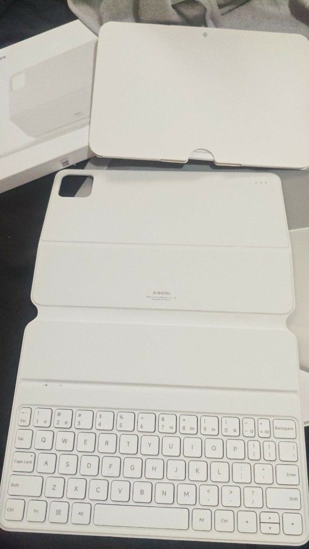 Xiaomi Pad 7 / 7 Pro Keyboard Case (Category: Cases & Sleeves) located in San Fernando. Submitted by brandeddeclutter. (Listing ID 1461594318, Image 3). Description: - Original Xiaomi Keyboard Case - Compatible with Pad 7 or 7 Pro - Color: White - Magnetic Attachment - Protects your tablet - Provides a typing experience - Folds into a convenient stand - Clean and well-maintained.