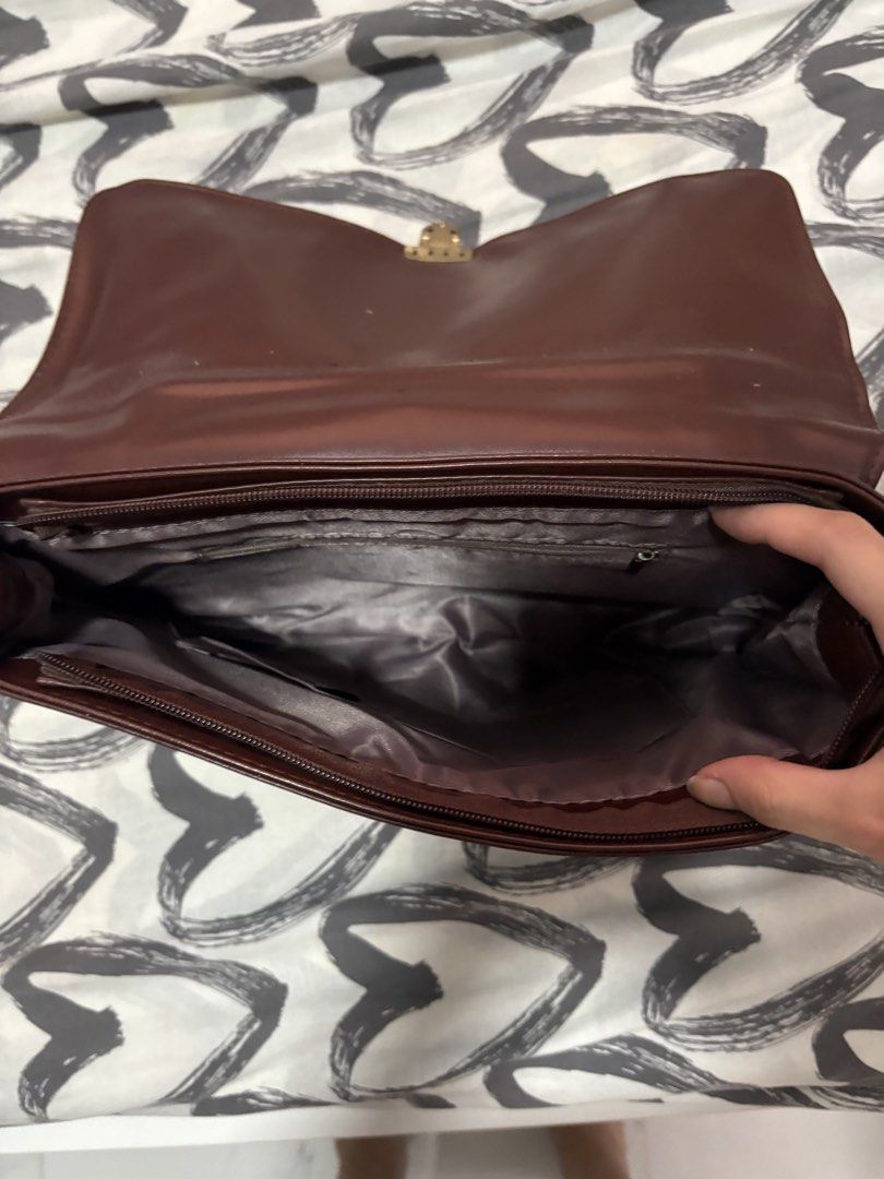 Y2k brown messenger / Satchel bags (Category: Shoulder Bags) located in Binan City. Submitted by eenvy_ (Listing ID 1461596491, Image 2). Description: Brown Messenger bag Semi small and sturdy Satin finish and gold buckles Mop: gcash Mod: jnt Dm for more details.