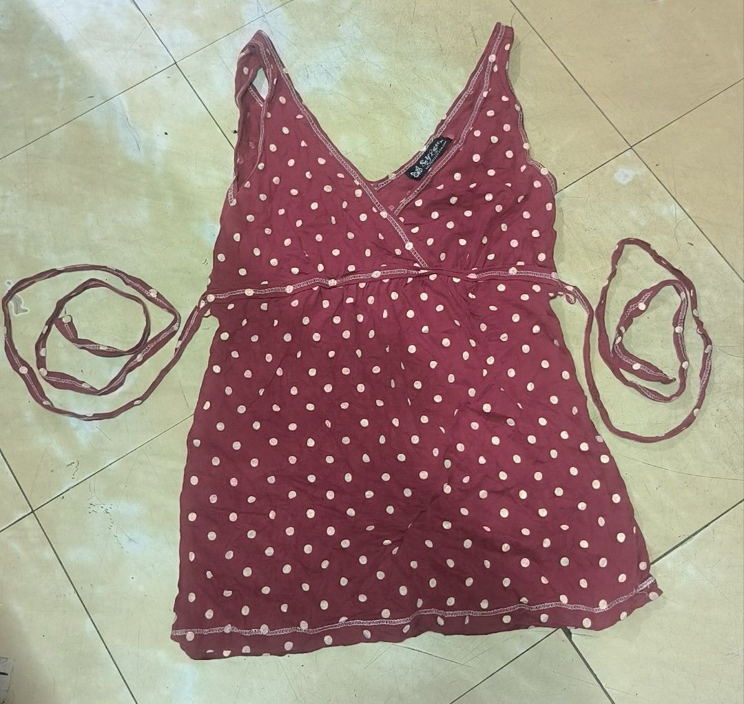 Y2k Self Esteem Red Polka Dot Wrap Top Size Small (Category: Blouses) located in Manila. Submitted by itsmelawrence (Listing ID 1461765205, Image 1). Description: - Red wrap top with white polka dots - Brand: Self Esteem - Size Small 13-15 width . length 24 - Material: 100% Cotton - Origin: Made in Mexico - Features: Tie straps, V-neckline - Style: Great for casual wear.