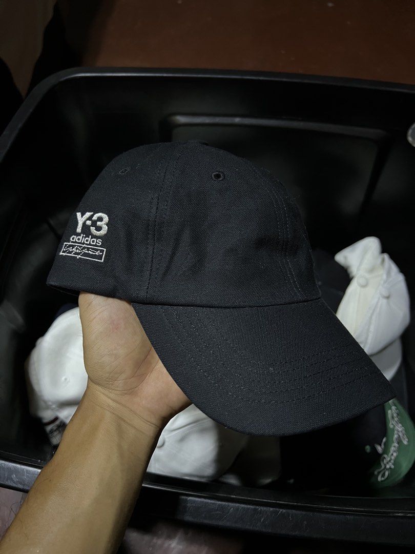 Y-3 Adidas Black Baseball Cap (Category: Caps & Hats) located in Davao. Submitted by dubdabi.co (Listing ID 1461780438, Image 1). Description: - Authentic Y-3 Adidas cap - Classic black baseball style - Embroidered Y-3 and Adidas logos on the side - Adjustable strap for a comfortable fit - Ideal for everyday wear - Brand new with original tags attached.