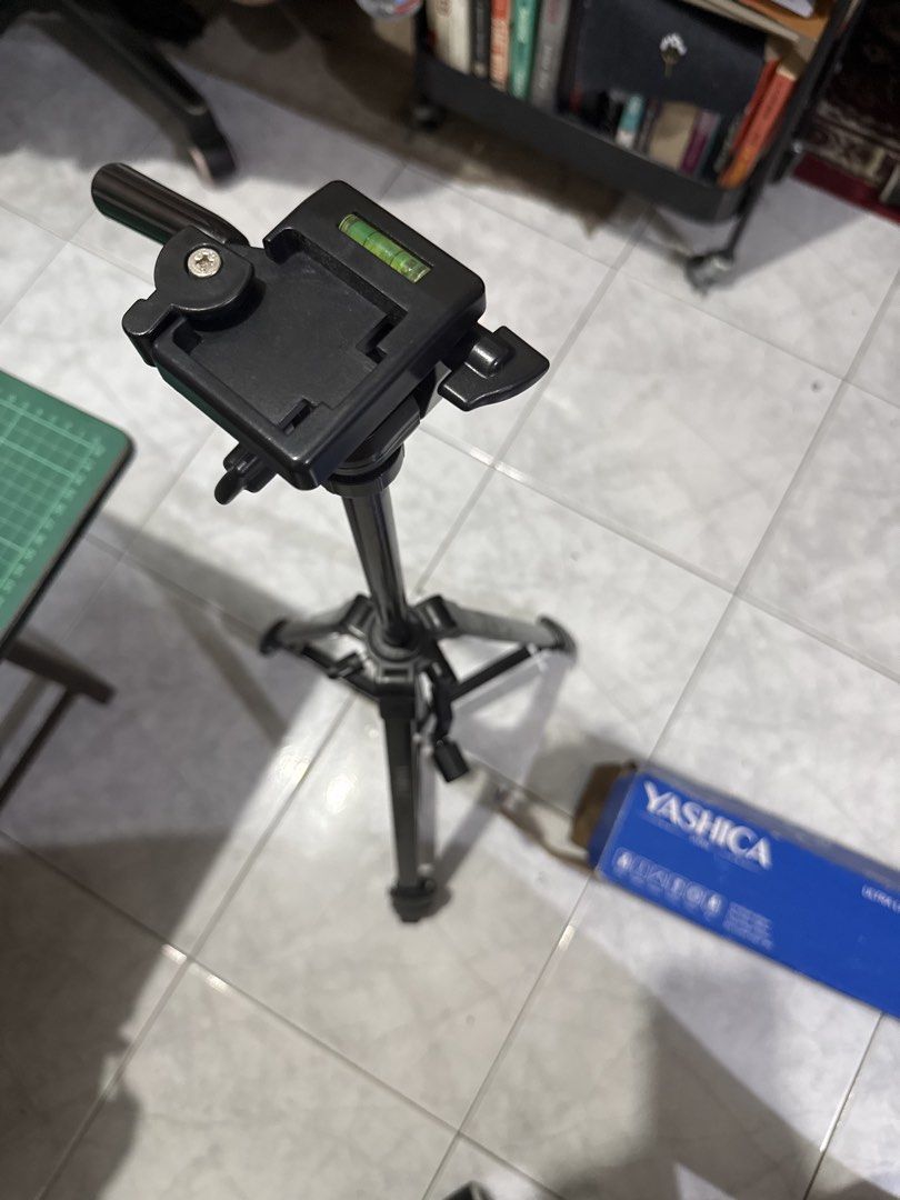 Yashica Multi Purpose Tripod (Category: Tripods & Monopods) located in Cainta. Submitted by lovemarie_03 (Listing ID 1461686916, Image 2). Description: Selling a Yashica ultra-lightweight tripod in good condition. Comes with the original carrying bag and box. Features adjustable legs, quick-release phone/camera mount, built-in bubble level, and a maximum height of 138cm. Lightweight at only 830g and supports up to 3kg. Great for cameras, smartpho