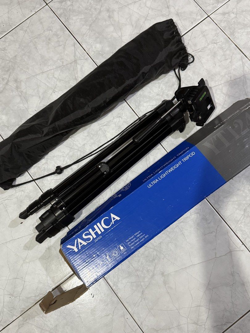 Yashica Multi Purpose Tripod (Category: Tripods & Monopods) located in Cainta. Submitted by lovemarie_03 (Listing ID 1461686916, Image 1). Description: Selling a Yashica ultra-lightweight tripod in good condition. Comes with the original carrying bag and box. Features adjustable legs, quick-release phone/camera mount, built-in bubble level, and a maximum height of 138cm. Lightweight at only 830g and supports up to 3kg. Great for cameras, smartpho