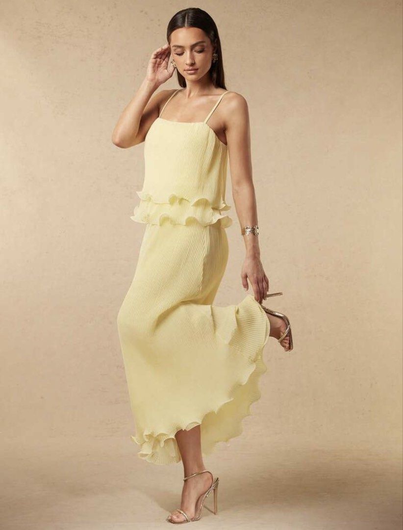 Yellow dress (Category: Dresses) located in Bulacan. Submitted by lily.marie (Listing ID 1461638936, Image 3). Description: - Flowy yellow maxi dress - Tiered ruffle design on bodice and hem - Spaghetti straps for a light feel - Ideal for events or a chic evening out - Comfortable and stylish - Looks amazing on Used only once for an event Very elegant looking Received a lot of compliments here Originally bought for 849 pesos, selling low.
