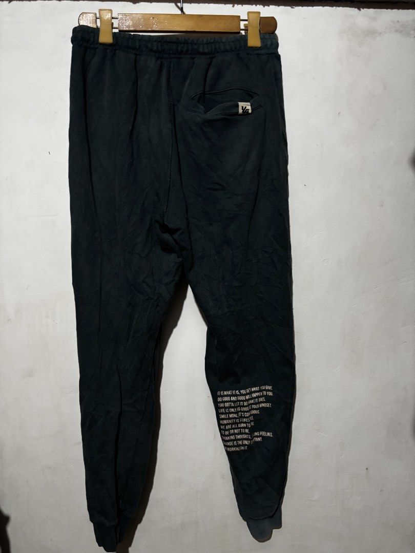 Young LA Joggers Pants (Category: Joggers) located in Subic. Submitted by thriftpoison (Listing ID 1461562390, Image 3). Description: - 'Young LA' logo on the front - Small back pocket with logo - Printed text on lower leg - Elastic waistband with drawstring - Ribbed cuffs - Large - Waist 32-36 Length 38.