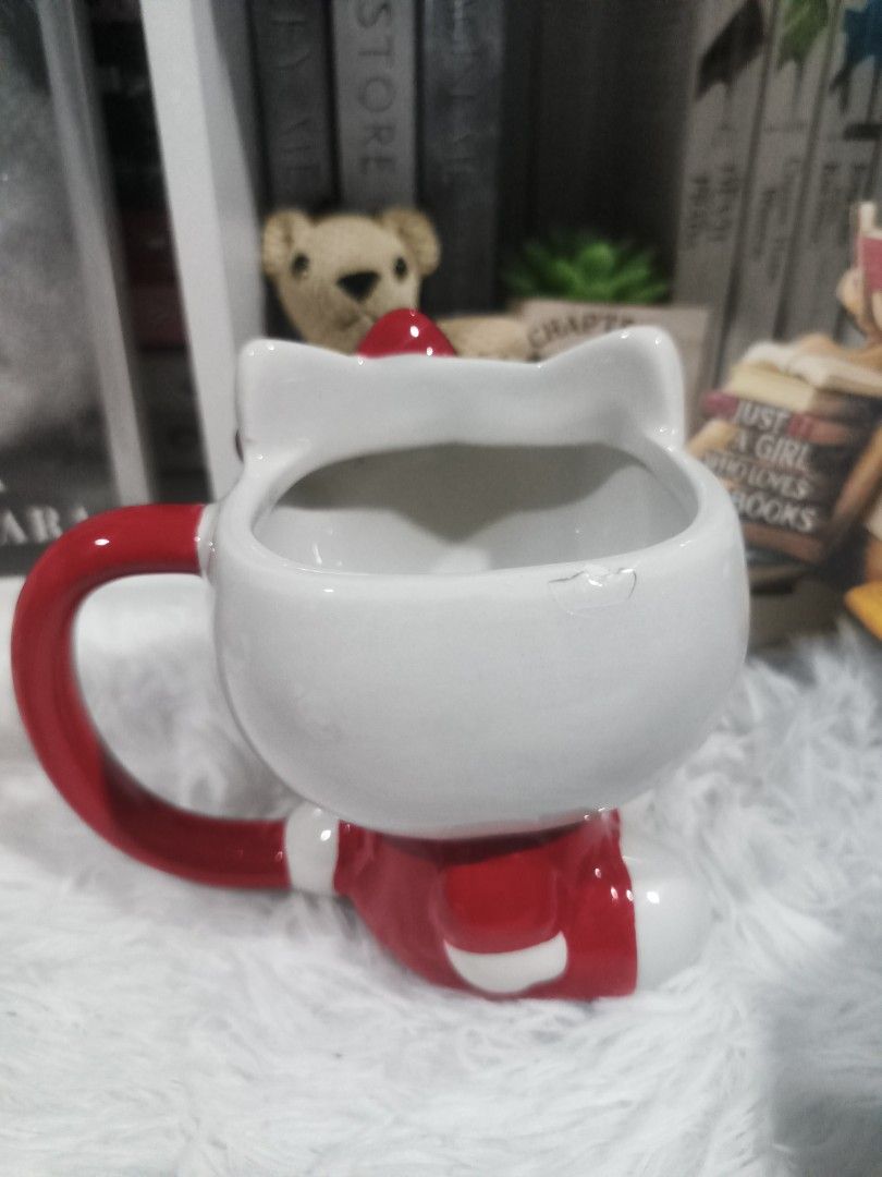 Zak! Hello Kitty Santa Ceramic Mug (Category: Coffee & Tea Tableware) located in Cabuyao City. Submitted by chaptersandwonders143 (Listing ID 1461715960, Image 2). Description: Condi: with minimal dent (posted in the picture) Not advisable for drinking purposes but can be use for display - Adorable Kitty mug - Eye-catching red handle and details. - Made by the reputable Zak! brand. - Care instructions: Hand wash only. - Ideal for Kitty collectors
