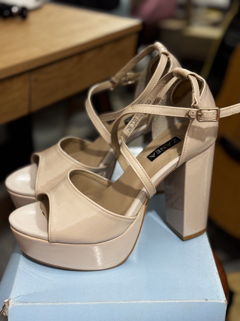 Zanea Patent Beige Platform Heels with Ankle Strap (Category: Heels) located in Bauang. Submitted by jeneefromtheblock (Listing ID 1461771896, Image 1). Description: - Brand: Zanea - Color: Beige - Material: Patent - Heel Type: Chunky block heel with platform sole - Closure: Ankle strap with buckle - Toe Style: Peep-toe - Size: 39 - Style Tip: Great for elevating any outfit - With signs of use (see pictures).