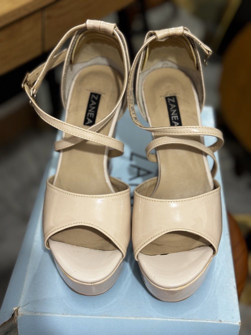 Zanea Patent Beige Platform Heels with Ankle Strap (Category: Heels) located in Bauang. Submitted by jeneefromtheblock (Listing ID 1461771896, Image 2). Description: - Brand: Zanea - Color: Beige - Material: Patent - Heel Type: Chunky block heel with platform sole - Closure: Ankle strap with buckle - Toe Style: Peep-toe - Size: 39 - Style Tip: Great for elevating any outfit - With signs of use (see pictures).