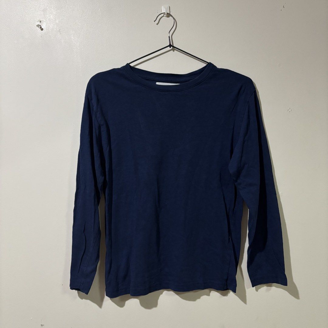Zara Basic Navy Blue Longsleeve (Category: Longsleeves) located in Binan City. Submitted by mypreloved_haul (Listing ID 1461701994, Image 1). Description: Zara Kids on tag can fit small adult The selected region shows a Zara Kids plain navy blue long sleeve t-shirt, a versatile everyday wardrobe essential made from soft, breathable cotton jersey fabric. It features a classic crew neck collar and a standard straight-cut regular fit..
