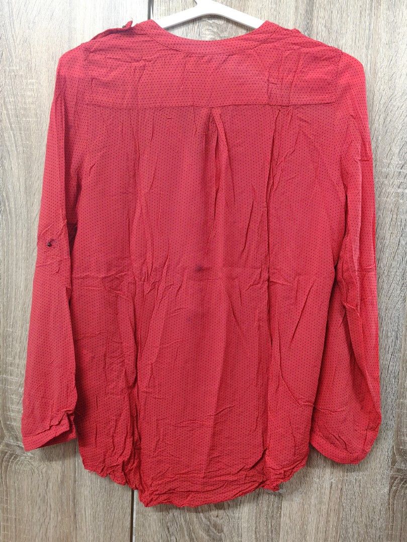Zara Basic Red Polka Dot Long Sleeve Blouse XS (Category: Blouses) located in Las Pinas. Submitted by offtonewhome (Listing ID 1461566982, Image 2). Description: - Red Zara basic blouse with classic black polka dots. - Features a flattering V-neck with a full button-up front. - Long sleeves with button detail at the cuff. - Convenient small pocket on the left chest. - Please note: a faint dark mark is present on the front, near the pocket (refer 