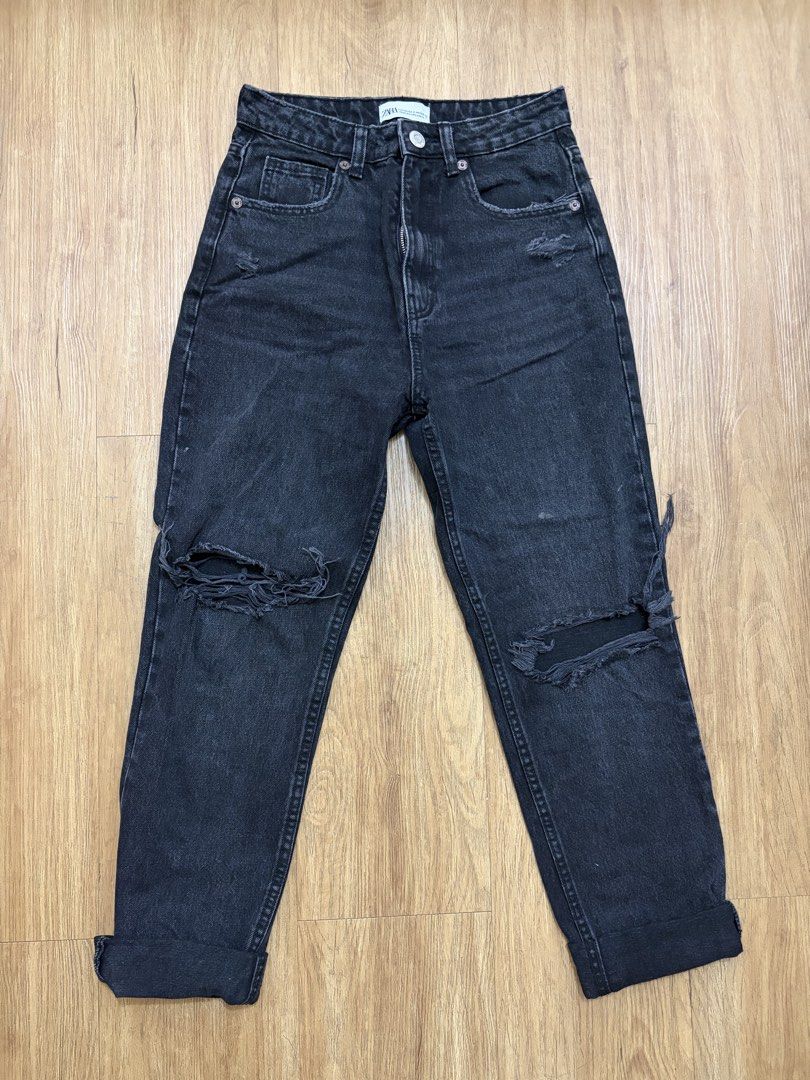 ZARA Black Ripped Mom Jeans (Category: Jeans) located in Taguig. Submitted by Shamieeee (Listing ID 1461727043, Image 1). Description: - Zara Black Mom Jeans - High-waisted style - Ripped details at knees and hem - Size: EUR 34 / US 2 / MEX 24 - Made in Bangladesh - Ideal for casual wear.