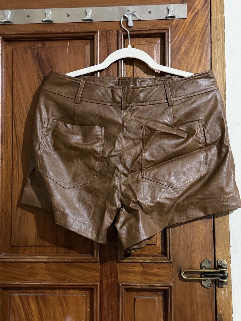 Zara chocolate brown leather skort (Category: Shorts) located in Quezon City. Submitted by latiendadejaye (Listing ID 1461685659, Image 3). Description: Purchased in Zara. Some stretch, best fits M-L In good condition, never worn except to try on MOP: BPI, Gcash, Maya RFS: cleaning out my closet .