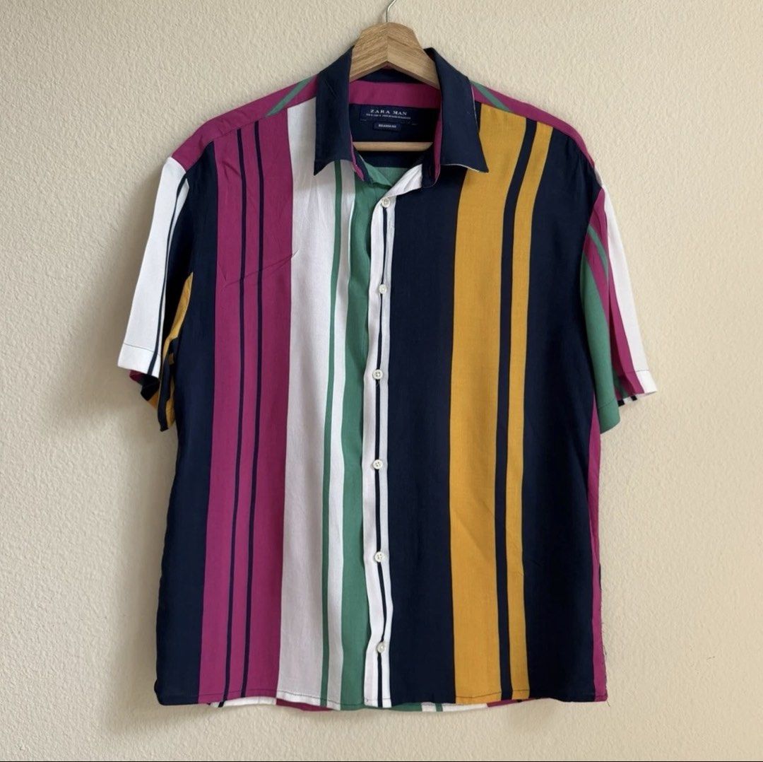 Zara Men’s short-sleeve button-up shirt (Category: Tshirts & Polo Shirts ) located in Paranaque City. Submitted by famsale2016 (Listing ID 1461618006, Image 2). Description: -Zara Men’s short-sleeve button-up shirt featuring bold, multicolored vertical stripes. -Size S but can fit up to L.