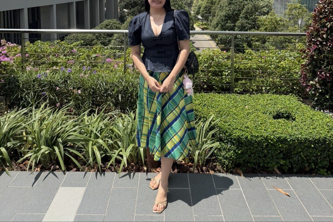 Zara Midi Skirt (Category: Skirts) located in Taguig. Submitted by princesszarashop (Listing ID 1461677662, Image 1). Description: - Size medium - Like new - Trendy midi skirt with a stylish green, blue, and yellow plaid pattern. - Flattering A-line silhouette. - Comfortable elastic waistband for a perfect fit. - Versatile piece: great for casual outings or dressing up. - Effortlessly pairs with a simple top for a complete look..